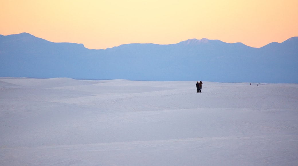 White Sands National Monument which includes desert views, a sunset and mountains