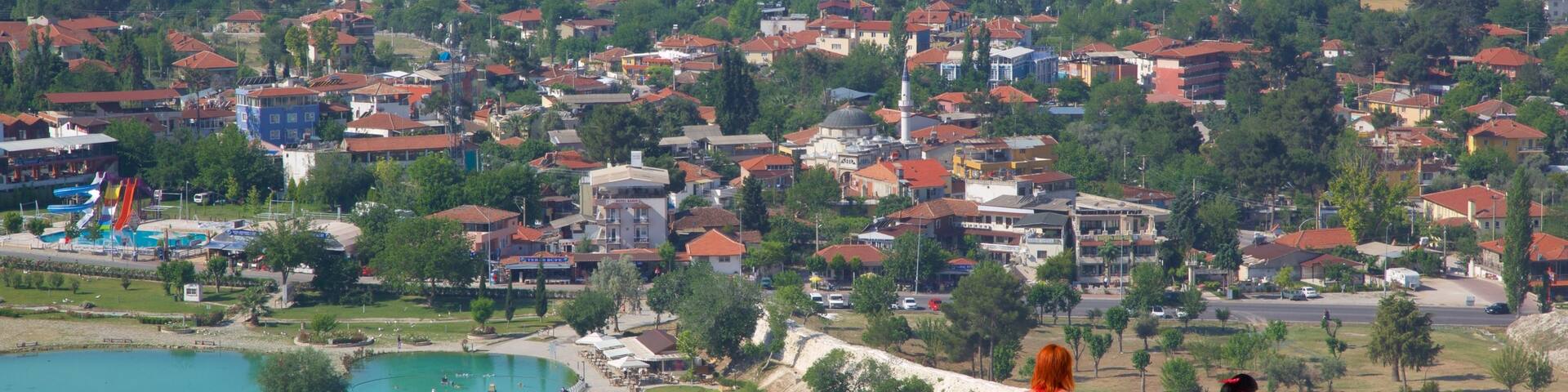 Pamukkale Thermal Pools featuring a small town or village and landscape views as well as a couple