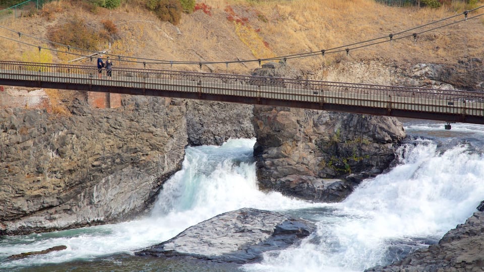 Riverfront Park featuring rapids, a bridge and a river or creek