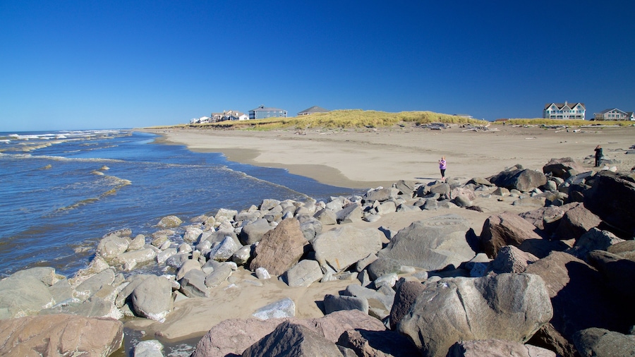 North Jetty which includes rocky coastline and a sandy beach
