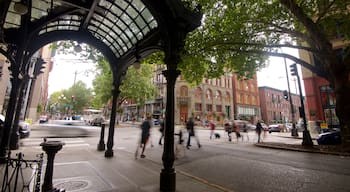 Pioneer Square som visar gatuliv, affärsdistrikt och historisk arkitektur