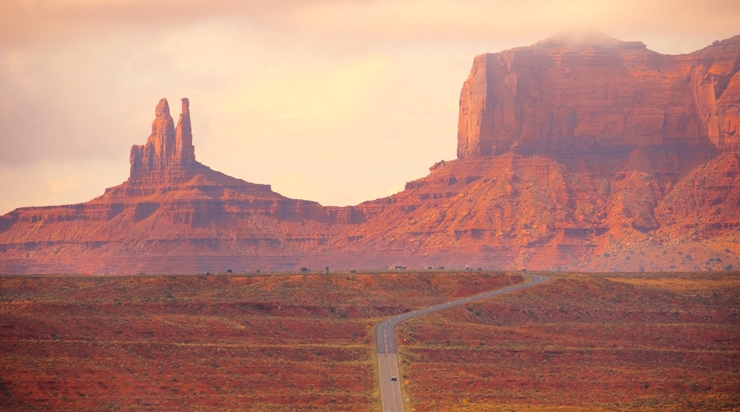 Monument Valley showing a gorge or canyon, a sunset and desert views