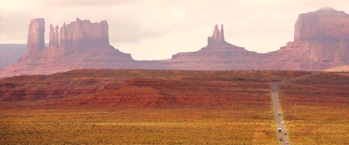 Monument Valley which includes tranquil scenes, a sunset and a gorge or canyon