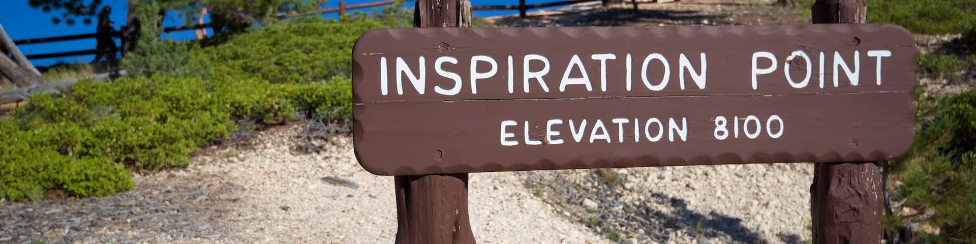 Inspiration Point which includes signage and desert views