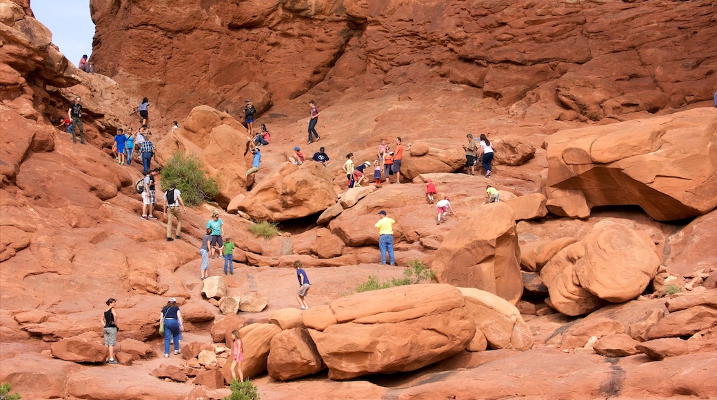 Double Arch which includes hiking or walking, mountains and tranquil scenes