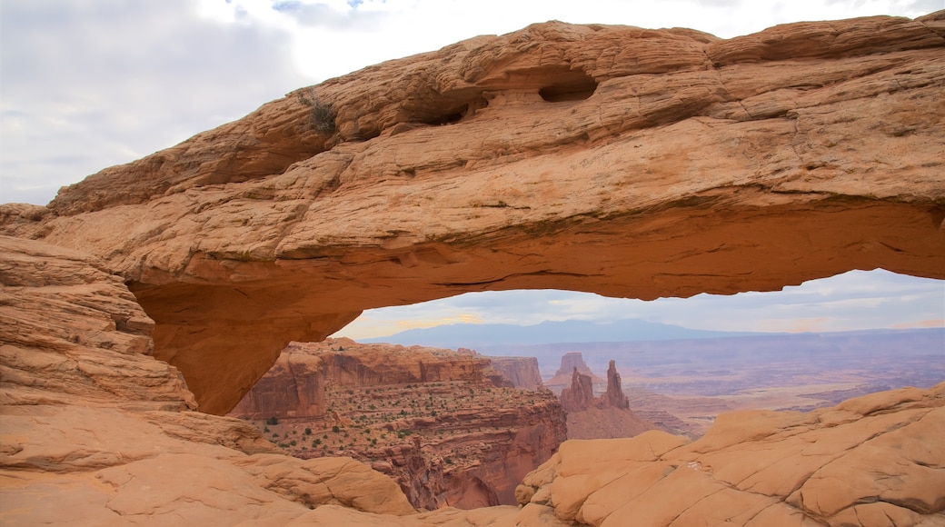 Mesa Arch Trail which includes tranquil scenes, a gorge or canyon and landscape views