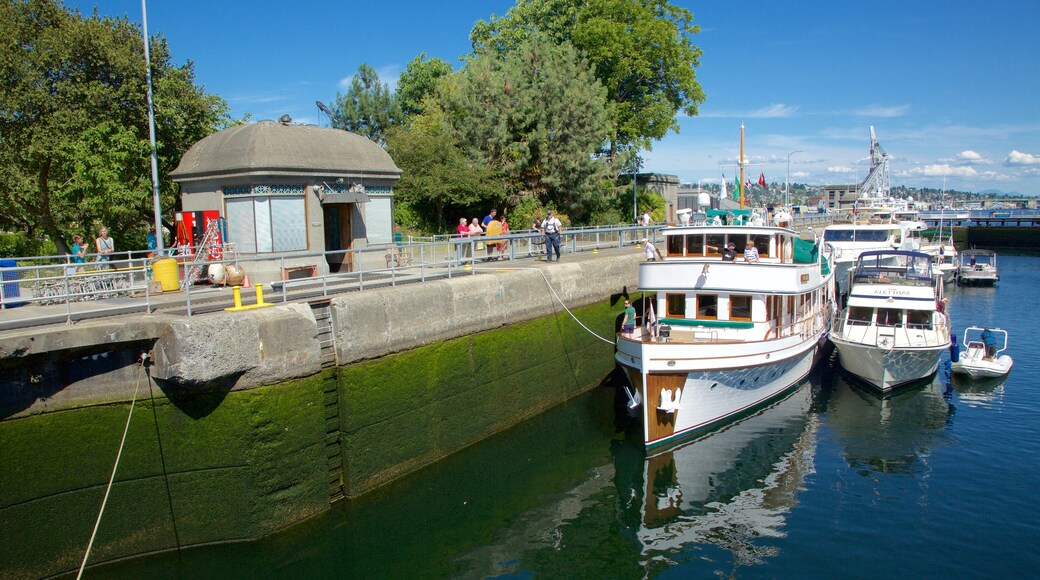 Hiram M. Chittenden Locks featuring a river or creek and boating as well as a small group of people