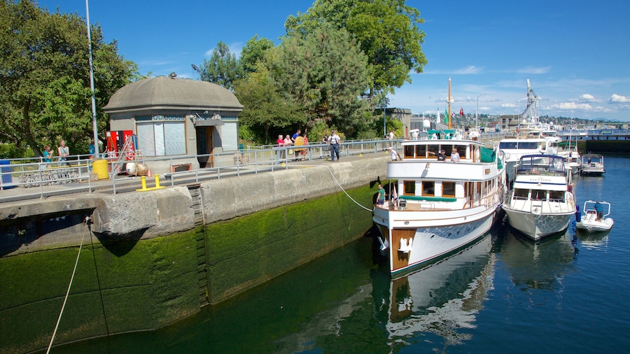Hiram M. Chittenden Locks which includes boating and a river or creek as well as a small group of people
