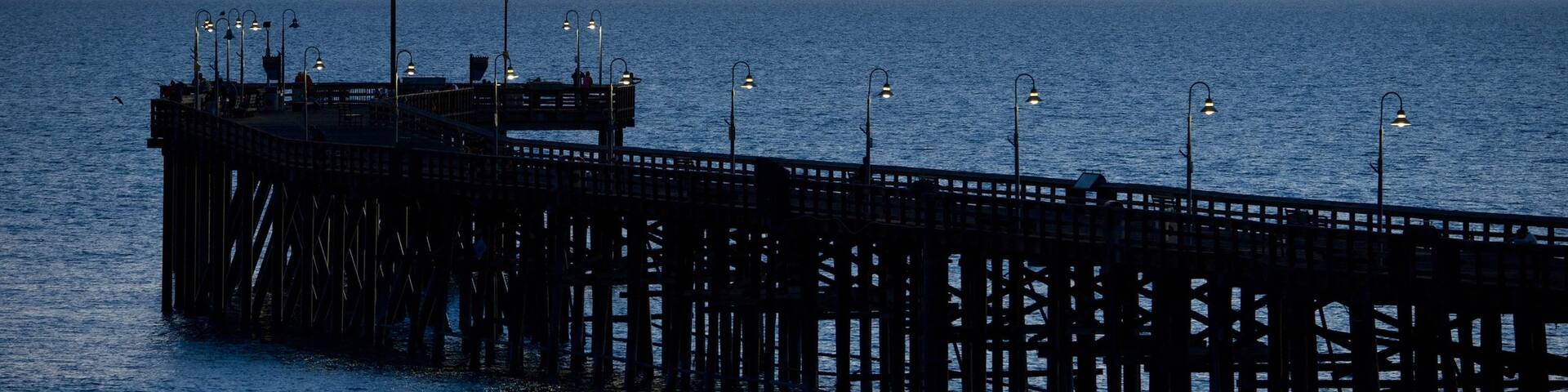 Ventura Pier which includes general coastal views, landscape views and a sunset