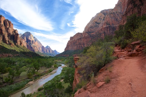 Zion National Park featuring mountains, a river or creek and a gorge or canyon
