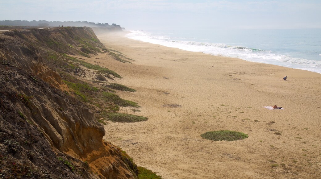 Half Moon Bay showing a beach and general coastal views