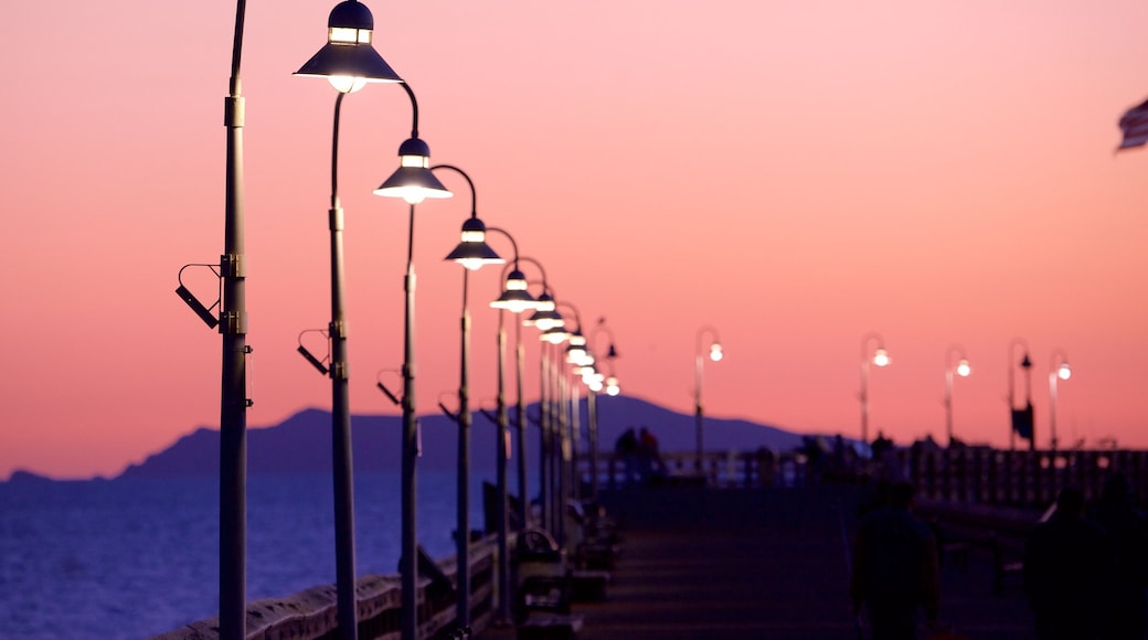 Ventura Pier showing a sunset and general coastal views