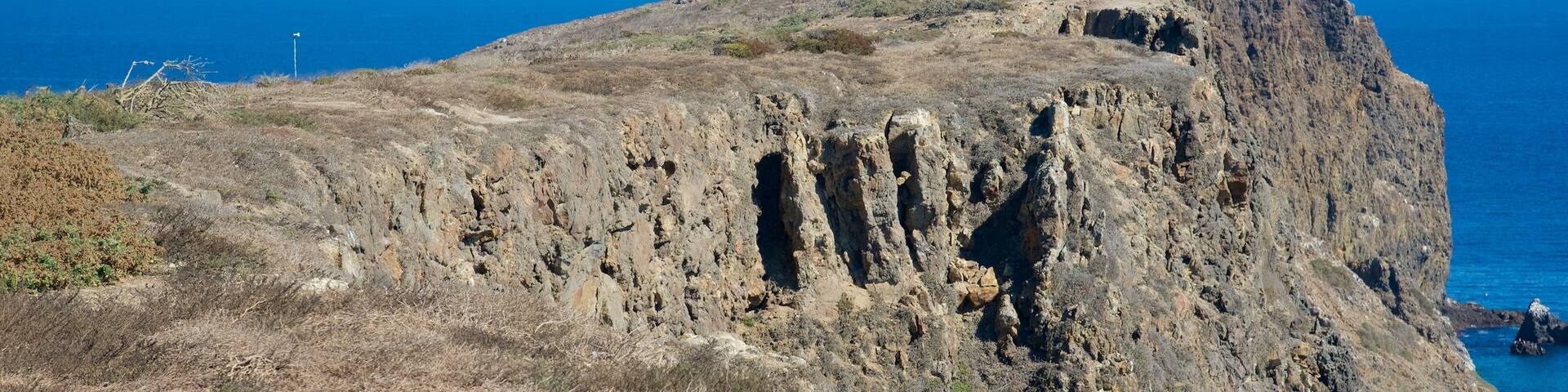 Ventura featuring rocky coastline and a lighthouse