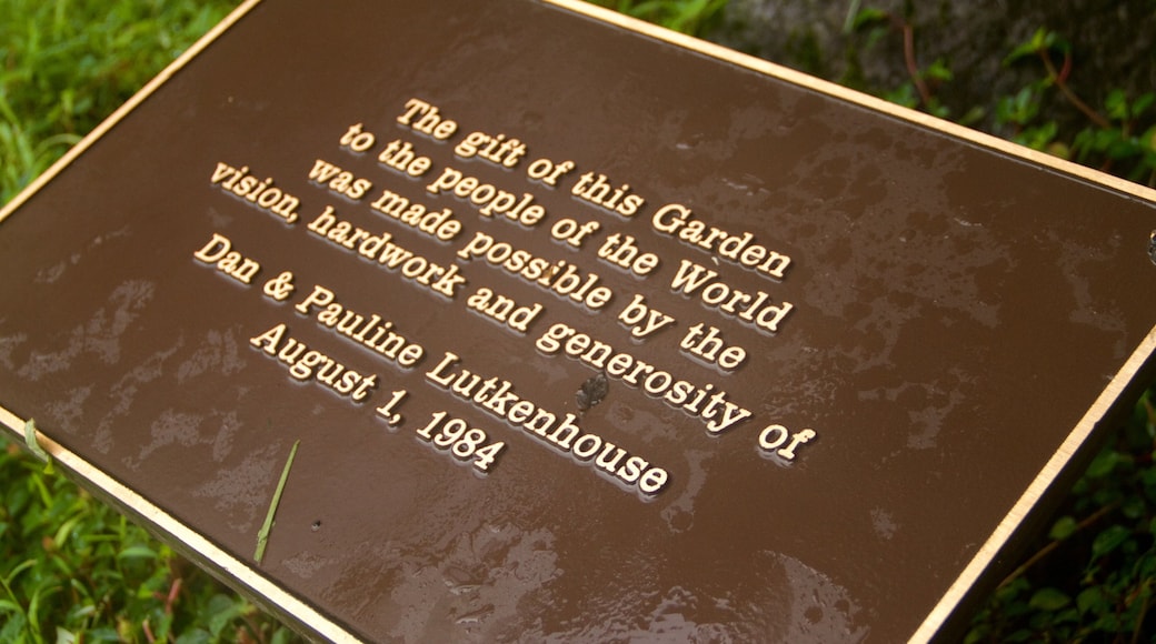 Hawaii Tropical Botanical Garden featuring signage and a garden