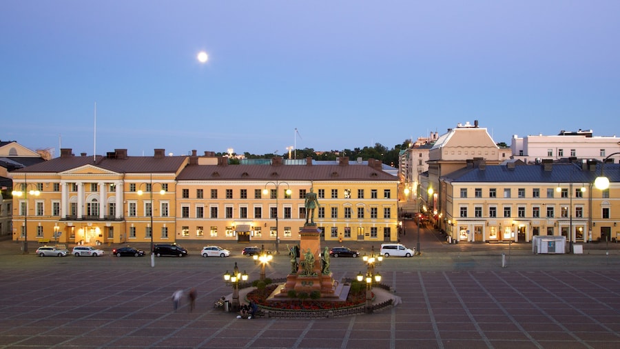 Senate Square which includes a square or plaza, a statue or sculpture and night scenes