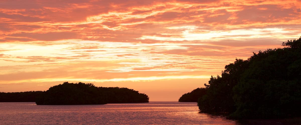 Everglades National Park featuring a sunset and general coastal views