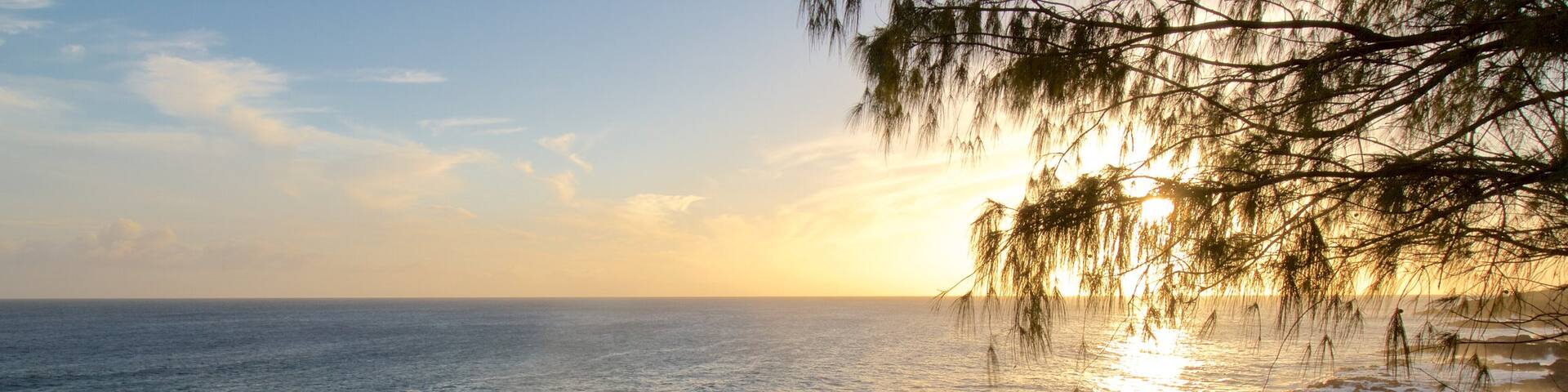 Spouting Horn which includes a pebble beach and a sunset