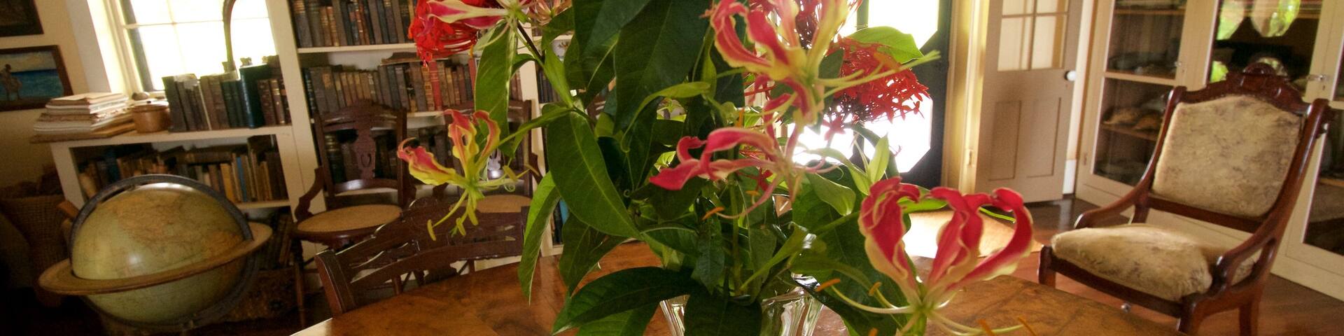 Grove Farm Homestead featuring flowers and interior views