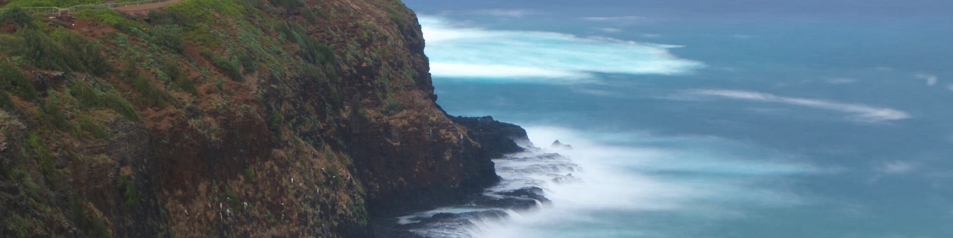 Kilauea Lighthouse which includes a lighthouse, general coastal views and a gorge or canyon