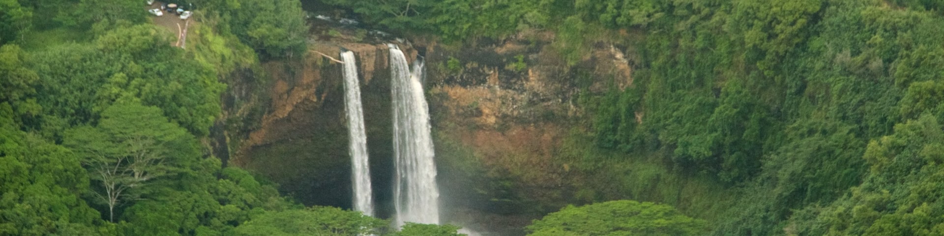 Wailua Falls which includes a cascade and forest scenes