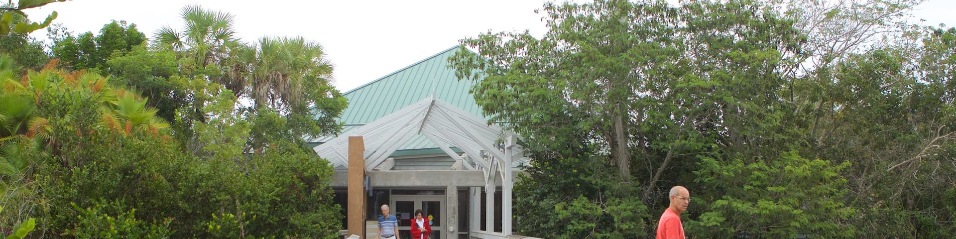 Ernest F. Coe Visitor Center showing a bridge as well as a small group of people