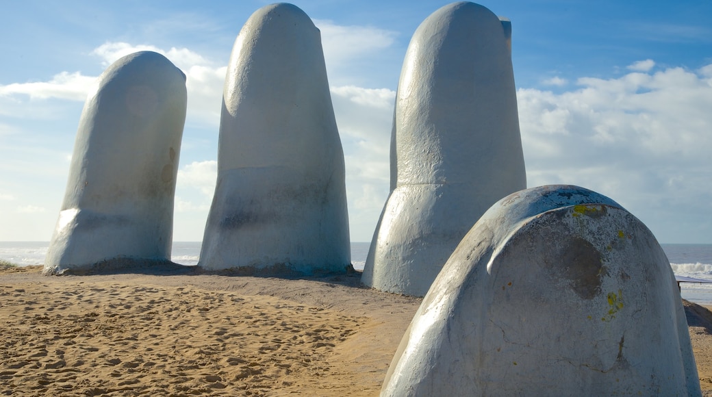 Brava Beach showing a statue or sculpture, outdoor art and general coastal views