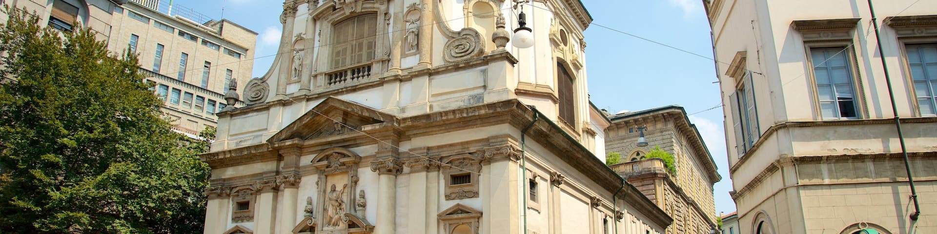 Milan featuring heritage architecture, street scenes and a church or cathedral