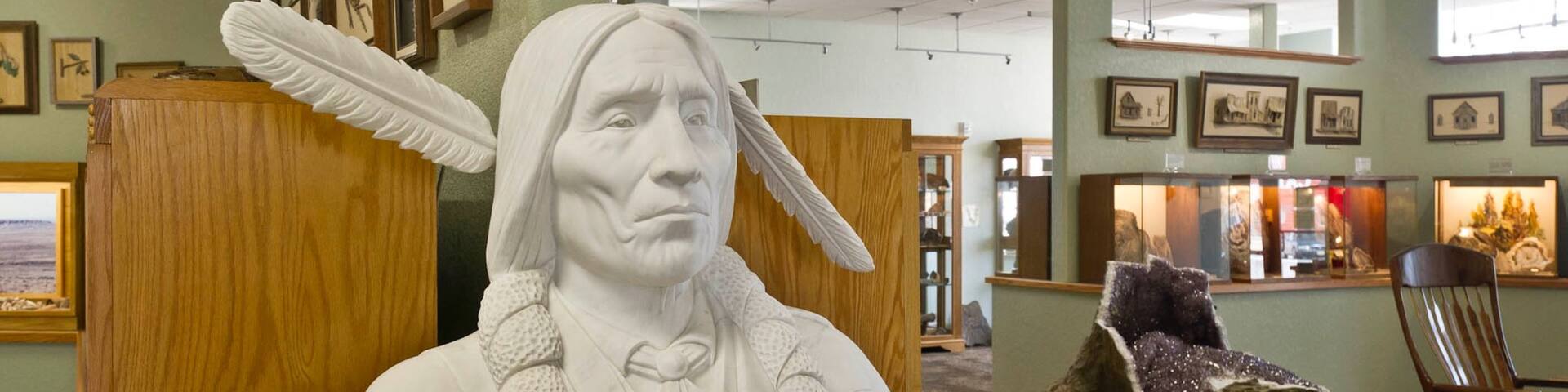 Petrified Wood Gallery showing a statue or sculpture and interior views