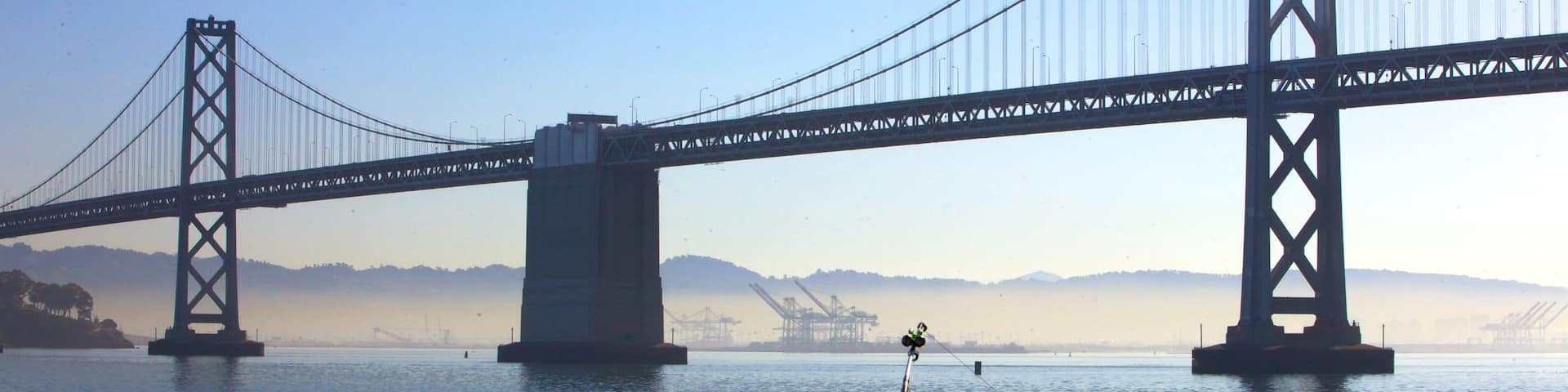 Bay Bridge which includes a river or creek, a bridge and modern architecture