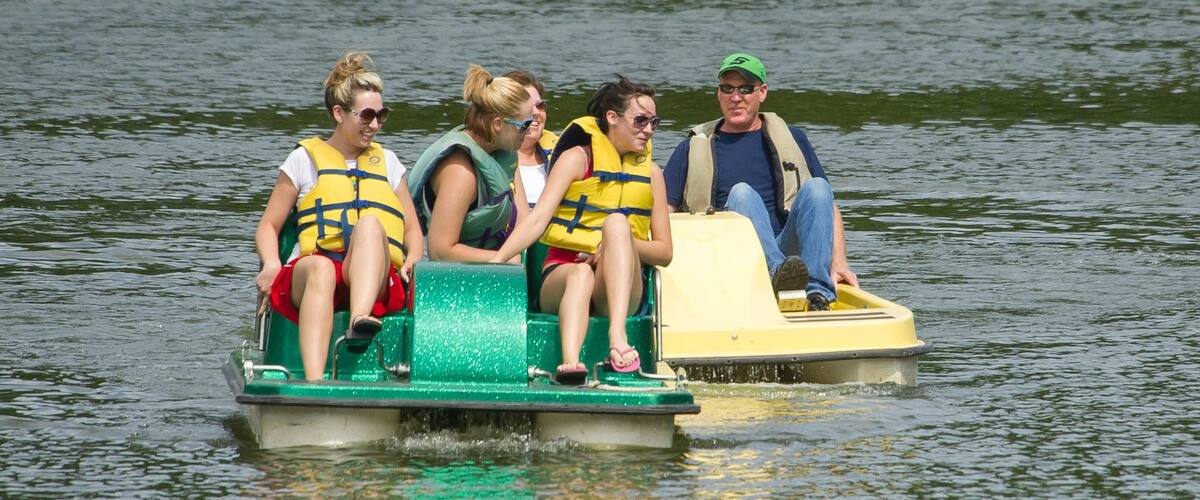 Lincoln which includes water sports and a river or creek as well as a small group of people