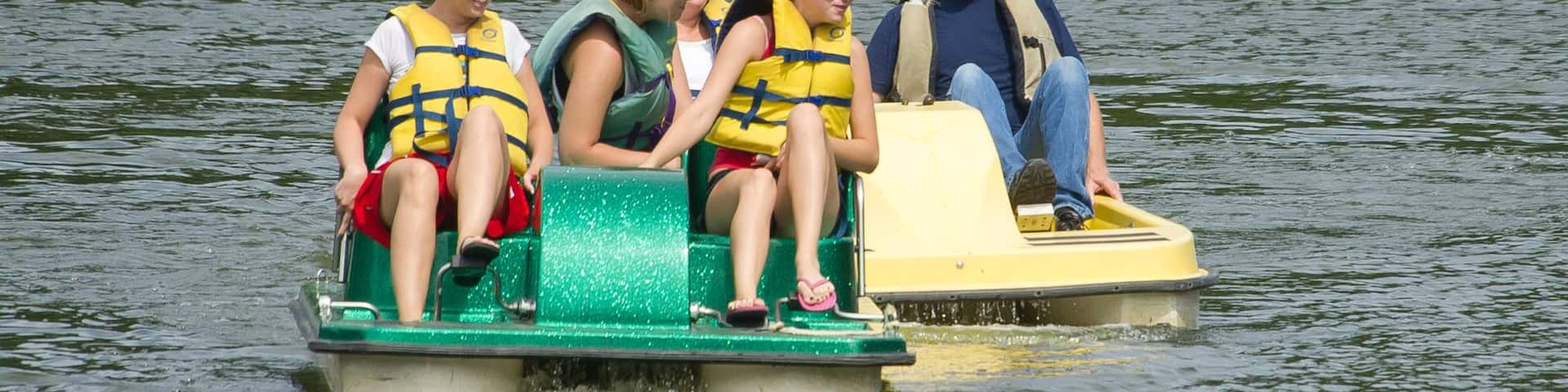 Lincoln showing water sports and a river or creek as well as a small group of people