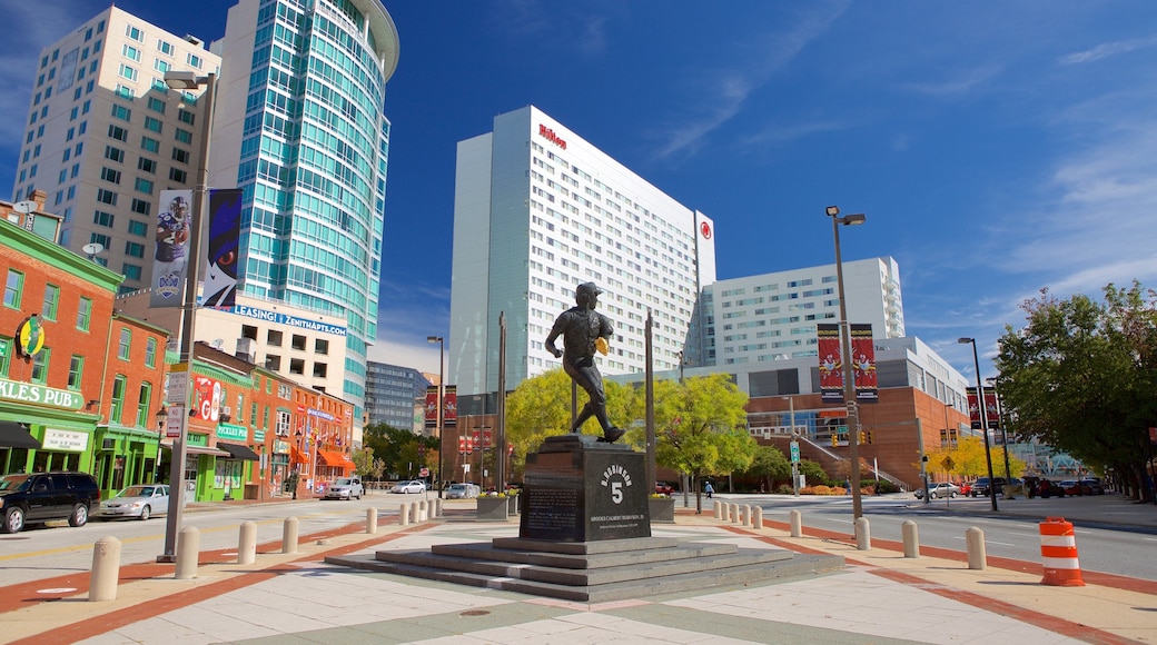 Baltimore which includes a square or plaza, a city and a statue or sculpture