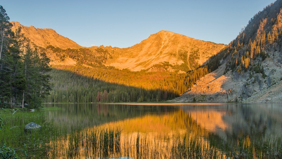 Southwest Montana featuring a lake or waterhole, mountains and a sunset