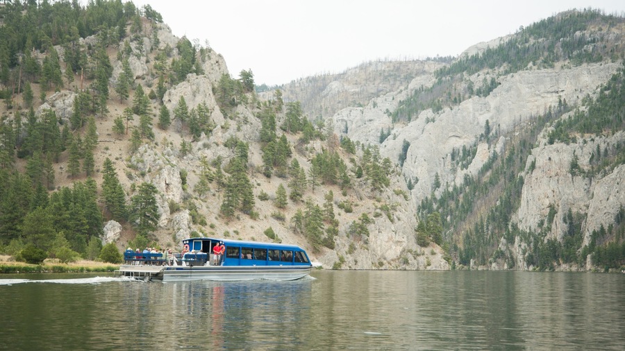 Southwest Montana featuring mountains, a lake or waterhole and boating