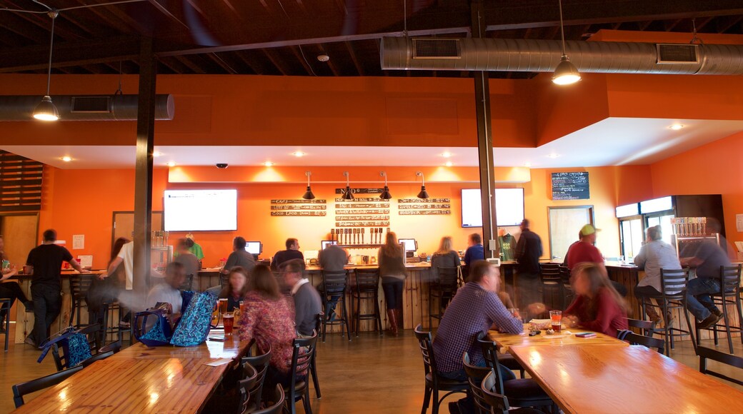 NoDa Brewing Company which includes interior views and a bar as well as a small group of people