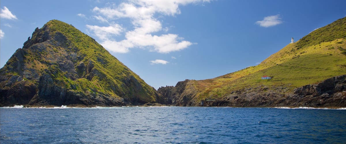 Russell featuring a bay or harbour and rocky coastline