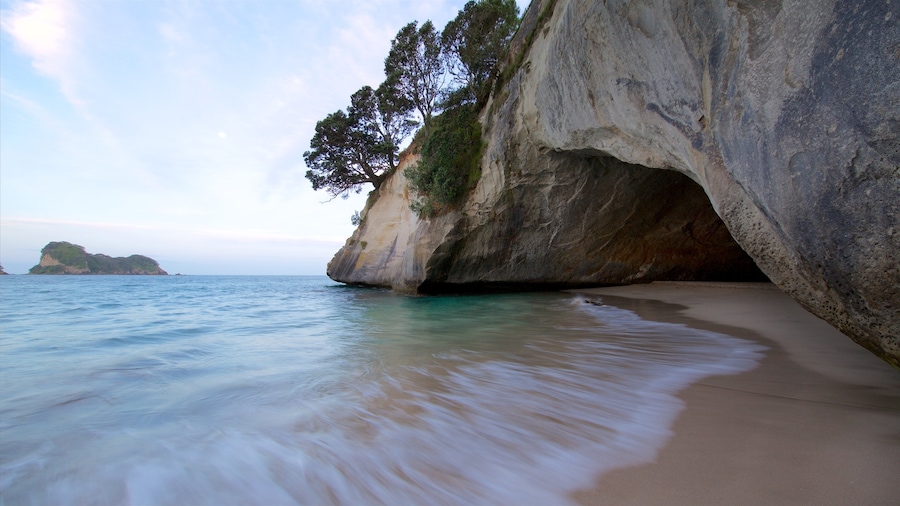 Coromandel Peninsula showing a beach, rugged coastline and a sunset