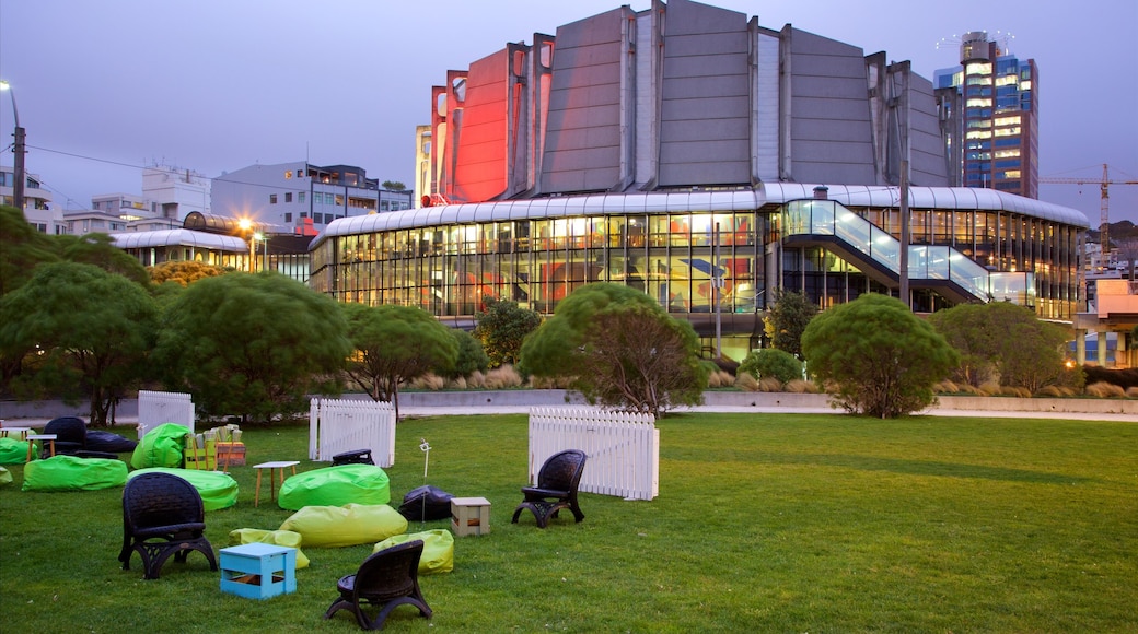 Michael Fowler Centre which includes a park, modern architecture and night scenes