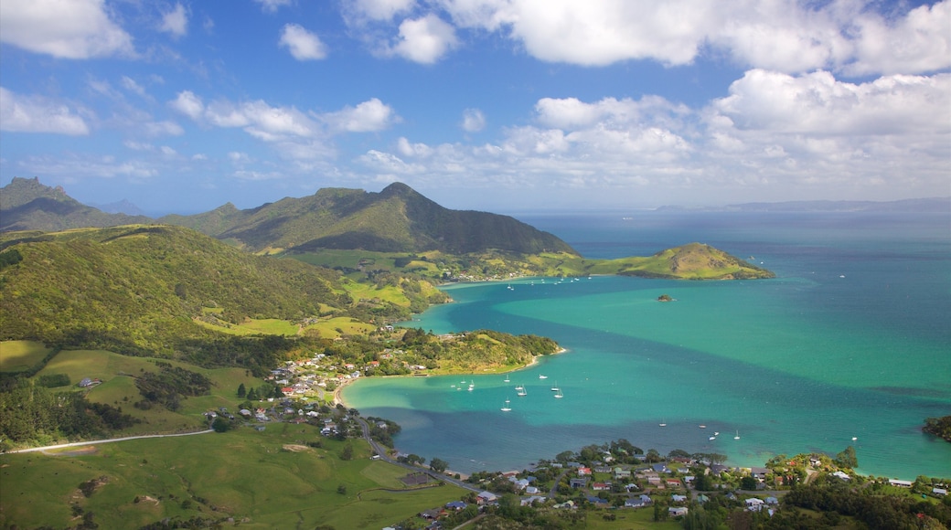 Mount Manaia showing a coastal town, a bay or harbour and mountains