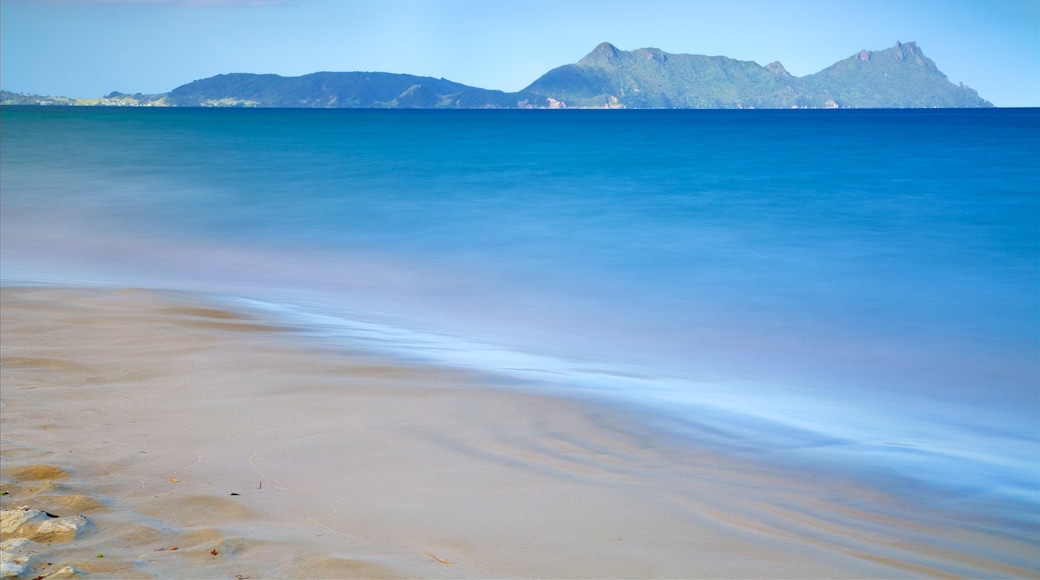 Whangarei showing a bay or harbour, mountains and a sandy beach