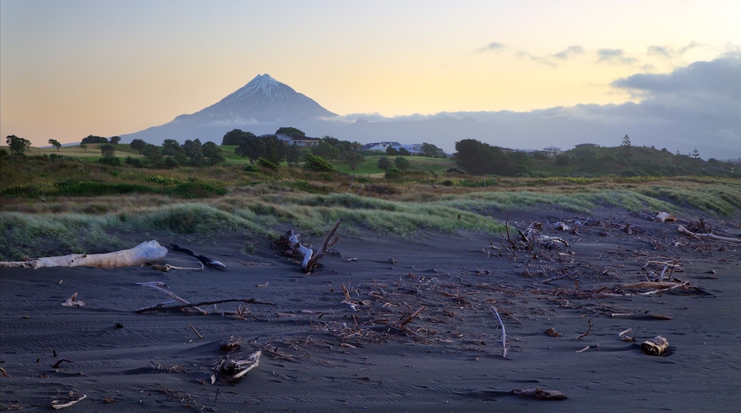 Taranaki featuring a sunset, mountains and tranquil scenes