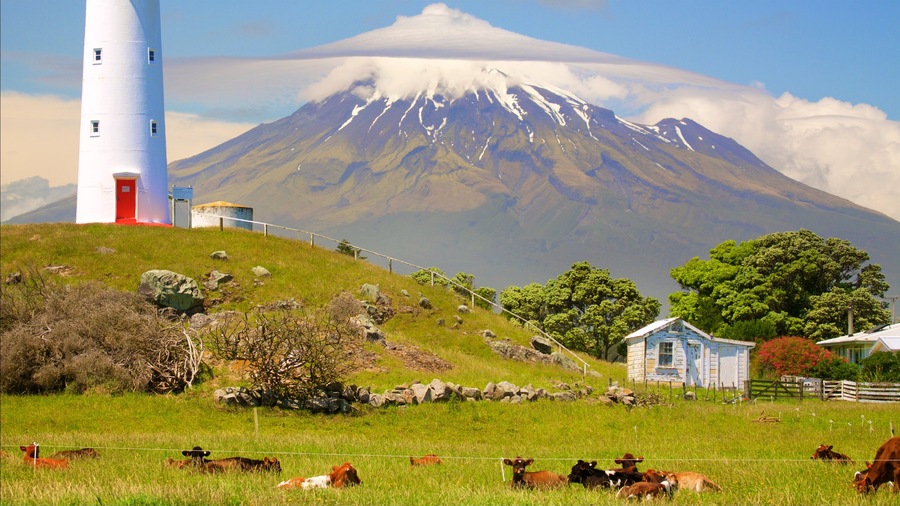 Taranaki which includes mountains, a lighthouse and farmland