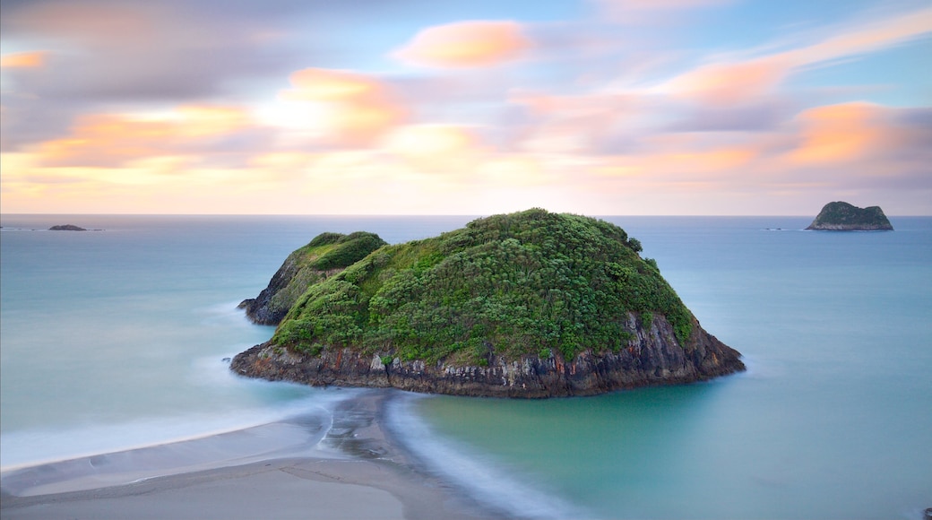 Sugar Loaf Marine Reserve which includes a sunset, island views and a bay or harbour