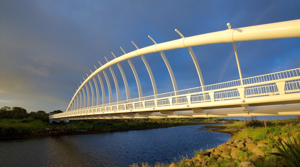 New Plymouth which includes a river or creek, a bridge and a sunset