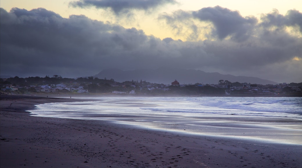 Fitzroy Beach showing a sunset, a bay or harbor and a coastal town