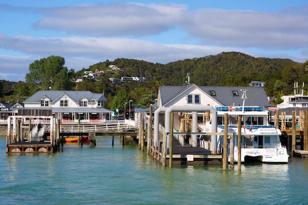 Paihia Wharf featuring a bay or harbour and a coastal town