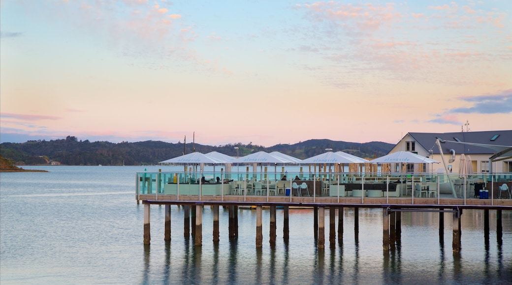 Paihia Wharf featuring a bay or harbour, a sunset and café lifestyle