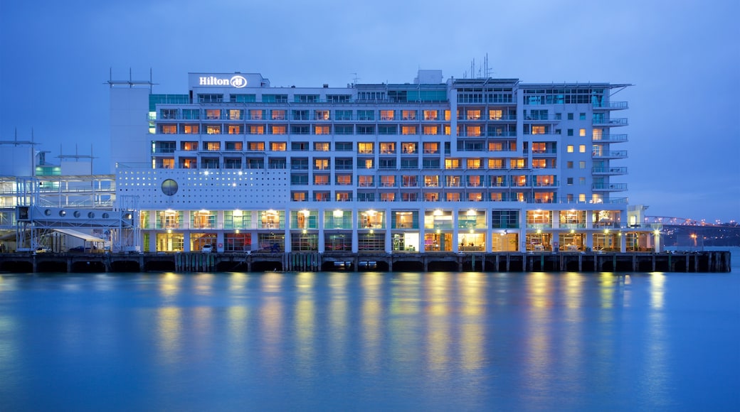 Queens Wharf featuring a bay or harbor and night scenes