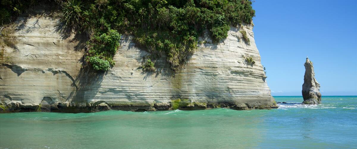 Urenui which includes rocky coastline and general coastal views