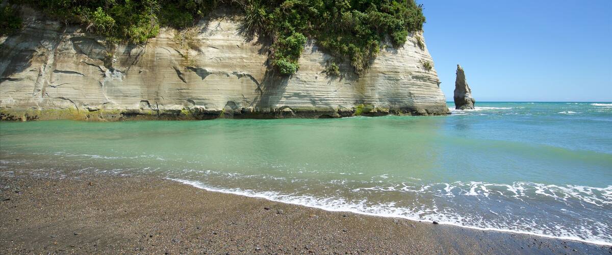 Urenui featuring rugged coastline, general coastal views and a pebble beach